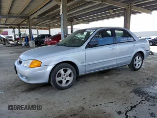 2000 Mazda Protege ES with VIN JM1BJ2212Y0308161, listed as a Copart auction lot 50794645 with 50,398 mi miles and Salvage Title. Bid and sale history available at DreamBid. Image 1.