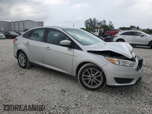 2018 Ford Focus SE with VIN 1FADP3F28JL256318, listed as a Copart auction lot 55524544 with 136,723 mi miles and Salvage title. Bid and sale history available at DreamBid. Image 4.
