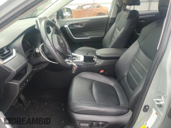 2023 Toyota RAV4 Hybrid XLE Premium with VIN JTMB6RFV8PD097109, listed as a Copart auction lot 59970995 with 43,197 mi miles and Salvage title. Bid and sale history available at DreamBid. Image 7.