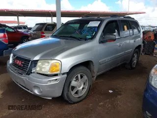 2004 GMC Envoy SLT with VIN 1GKDS13S942267554, listed as a IAAI auction lot 41754066 with 178,895 mi miles. Bid and sale history available at carsss.com. Image 2.