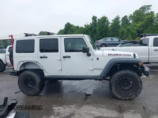 2014 Jeep Wrangler Unlimited Rubicon with VIN 1C4HJWFG4EL104827, listed as a IAAI auction lot 42236622 with 90,935 mi miles and . Bid and sale history available at DreamBid. Image 14.