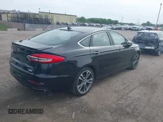 2020 Ford Fusion Titanium with VIN 3FA6P0K94LR117138, listed as a IAAI auction lot 42345819 with 88,117 mi miles and . Bid and sale history available at DreamBid. Image 4.