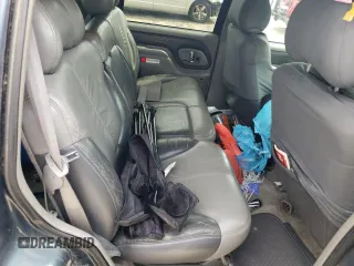 1999 GMC Denali z VIN 1GKEK13R5XR906686, wystawiony jako Copart lot #64451994 z przebiegiem 273 180 mil mil oraz Szkody całkowita. Historia ofert i sprzedaży dostępna na DreamBid. Obrazek 11.