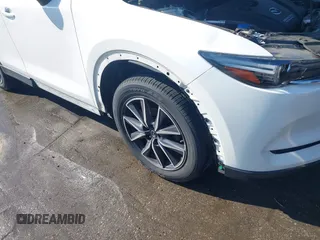 2018 Mazda CX-5 Grand Touring z VIN JM3KFBDM8J0420422, wystawiony jako IAAI lot #42188348 z przebiegiem 102 216 mil mil oraz . Historia ofert i sprzedaży dostępna na DreamBid. Obrazek 6.