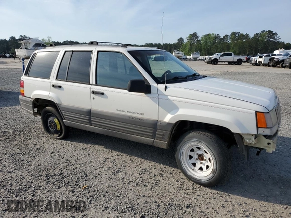 1996 Jeep Grand Cherokee Laredo z VIN 1J4EX58S3TC144191, wystawiony jako Copart lot #53153495 z przebiegiem 197 853 mil mil oraz Szkoda całkowita • Salvage title. Historia ofert i sprzedaży dostępna na DreamBid. Obrazek 4.