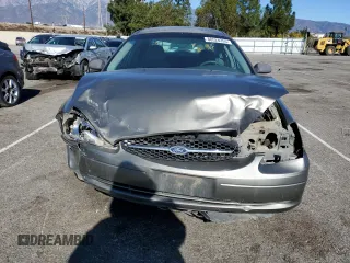 2001 Ford Taurus LX Standard z VIN 1FAFP52U51A138332, wystawiony jako Copart lot #88528355 z przebiegiem 166 511 mil mil oraz Szkoda całkowita • Salvage title. Historia ofert i sprzedaży dostępna na DreamBid. Obrazek 5.