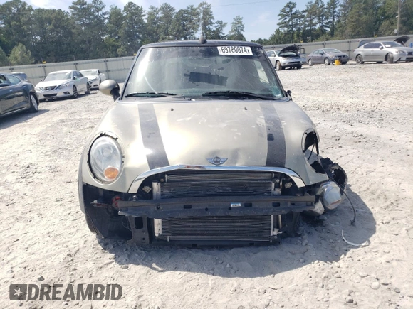 2011 MINI Convertible with VIN WMWZN3C54BT133246, listed as a Copart auction lot 69780074 with 176,955 mi miles and Salvage title. Bid and sale history available at DreamBid. Image 5.