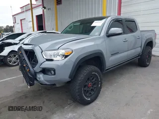2021 Toyota Tacoma SR z VIN 5TFCZ5AN5MX281428, wystawiony jako IAAI lot #41893437 z przebiegiem 36 204 mil mil oraz . Historia ofert i sprzedaży dostępna na DreamBid. Obrazek 17.