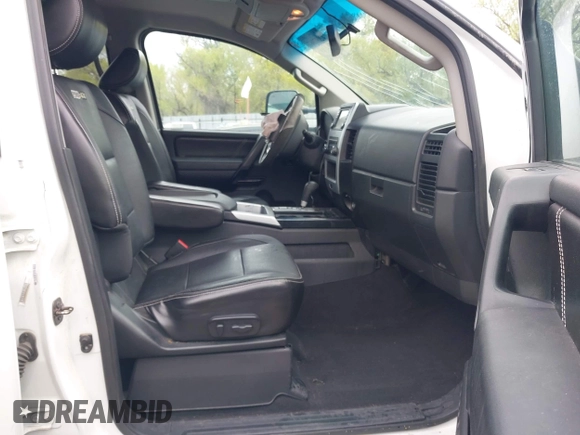 2014 Nissan Titan Pro-4X with VIN 1N6BA0ECXEN501915, listed as a IAAI auction lot 42097967 with 120,851 mi miles and . Bid and sale history available at DreamBid. Image 5.