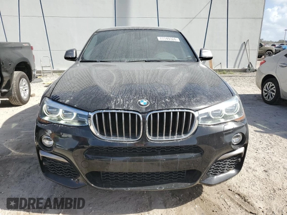 2017 BMW X4 M40i with VIN 5UXXW7C51H0U25766, listed as a Copart auction lot 77749324 with 101,289 mi miles and Salvage Title. Bid and sale history available at carsss.com. Image 5.