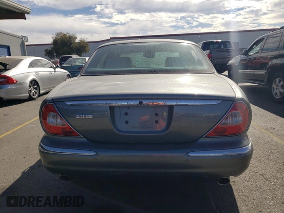 2005 Jaguar XJ with VIN SAJWA79C15SG40523, listed as a Copart auction lot 77994844 with 113,634 mi miles and Clean Title. Bid and sale history available at carsss.com. Image 6.