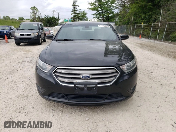 2013 Ford Taurus SEL z VIN 1FAHP2H84DG102036, wystawiony jako Copart lot #57772285 z przebiegiem 156 609 mil mil oraz Czysty tytuł • Clean title. Historia ofert i sprzedaży dostępna na DreamBid. Obrazek 5.