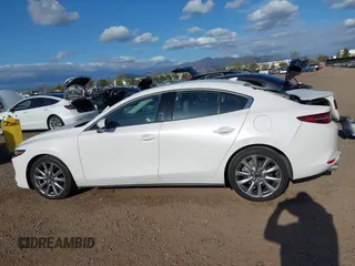 2020 Mazda 3 Premium with VIN 3MZBPAEM3LM132772, listed as a IAAI auction lot 42067269 with 53,751 mi miles and . Bid and sale history available at DreamBid. Image 14.
