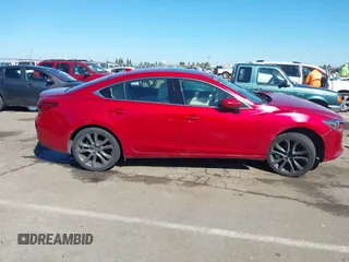 2016 Mazda 6 i Grand Touring с VIN JM1GJ1W50G1430328, выставлен на аукционе IAAI как лот 41879262 с пробегом 122 545 миль миль и . История ставок и продаж доступна на DreamBid. Изображение 14.