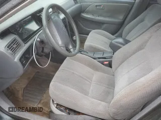 2001 Toyota Camry CE z VIN JT2BG22K710561238, wystawiony jako Copart lot #56686255 z przebiegiem Nie podano mil oraz Szkoda całkowita • Salvage title. Historia ofert i sprzedaży dostępna na DreamBid. Obrazek 7.