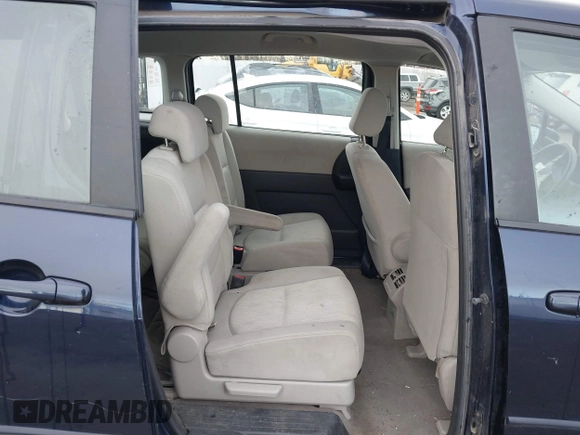 2009 Mazda 5 Sport with VIN JM1CR29L890356690, listed as a IAAI auction lot 41169351 with 118,582 mi miles and . Bid and sale history available at DreamBid. Image 8.