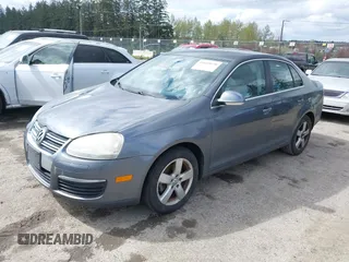 2009 Volkswagen Jetta Sedan SE with VIN 3VWRM71K59M069259, listed as a IAAI auction lot 41818850 with 164,157 mi miles. Bid and sale history available at carsss.com. Image 2.
