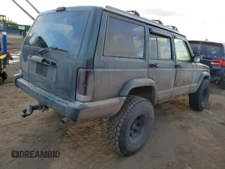 1997 Jeep Cherokee Country with VIN 1J4FJ78SXVL566804, listed as a Copart auction lot 88557395 with 216,230 mi miles and Salvage title. Bid and sale history available at DreamBid. Image 3.