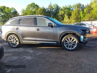 2018 Mazda CX-9 Grand Touring with VIN JM3TCBDY3J0231936, listed as a IAAI auction lot 42159391 with 105,125 mi miles and . Bid and sale history available at DreamBid. Image 14.