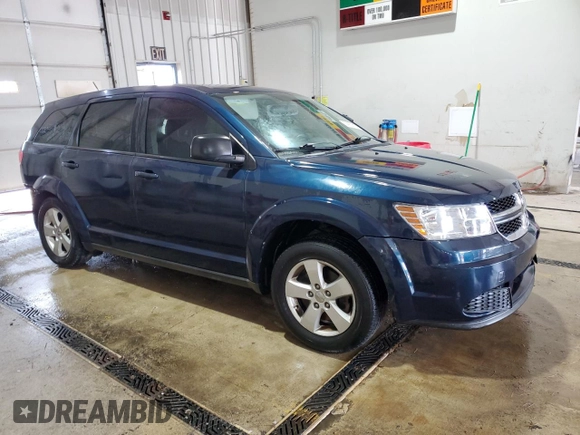 2013 Dodge Journey American Value with VIN 3C4PDCAB4DT581984, listed as a Copart auction lot 59953515 with 166,927 mi miles and Salvage title. Bid and sale history available at DreamBid. Image 4.