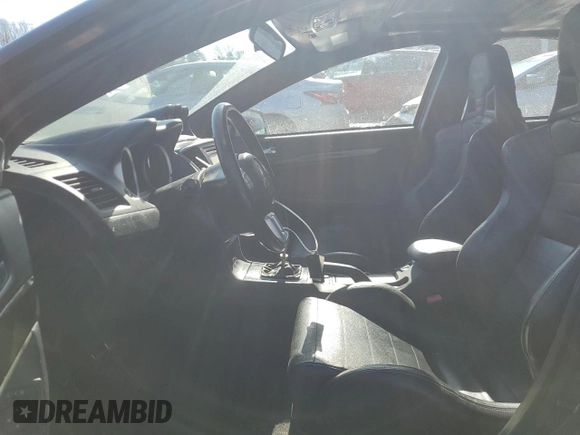 2014 Mitsubishi Lancer Evolution GSR z VIN JA32W8FV6EU010233, wystawiony jako Copart lot #42787275 z przebiegiem 74 780 mil mil oraz Szkody całkowita. Historia ofert i sprzedaży dostępna na DreamBid. Obrazek 7.
