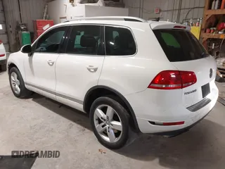 2011 Volkswagen Touareg Sport with VIN WVGFF9BP8BD004747, listed as a IAAI auction lot 41780515 with 159,228 mi miles and . Bid and sale history available at DreamBid. Image 3.