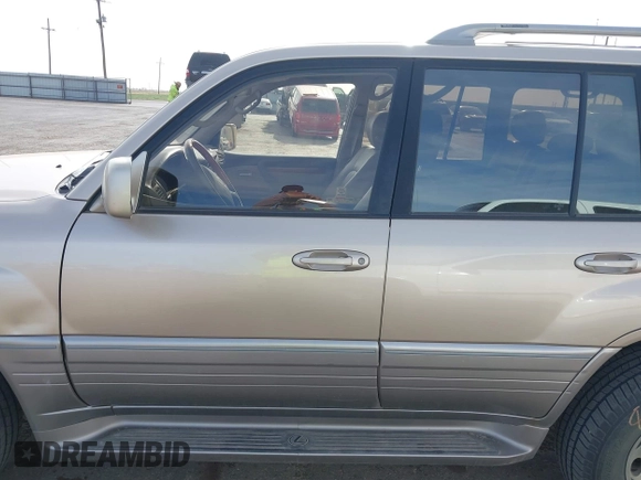 2000 Lexus LX 470 with VIN JT6HT00W0Y0098917, listed as a IAAI auction lot 41937661 with 180,980 mi miles and . Bid and sale history available at DreamBid. Image 14.