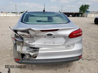 2015 Ford Focus SE z VIN 1FADP3F22FL343834, wystawiony jako Copart lot #58076265 z przebiegiem 101 891 mil mil oraz Szkoda całkowita • Salvage title. Historia ofert i sprzedaży dostępna na DreamBid. Obrazek 6.