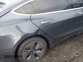 2019 Tesla Model 3 Mid Range with VIN 5YJ3E1EA3KF426971, listed as a IAAI auction lot 41564939 with Not Provided miles and . Bid and sale history available at carsss.com. Image 22.