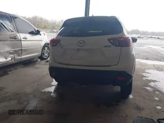 2014 Mazda CX-5 Touring with VIN JM3KE4CY9E0370610, listed as a IAAI auction lot 42016896 with 72,340 mi miles. Bid and sale history available at carsss.com. Image 15.