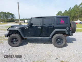 2012 Jeep Wrangler Unlimited Sport with VIN 1C4BJWDG2CL258264, listed as a IAAI auction lot 41880235 with 173,661 mi miles. Bid and sale history available at carsss.com. Image 15.