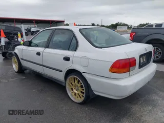 1997 Honda Civic LX z VIN 2HGEJ6676VH534795, wystawiony jako IAAI lot #42170378 z przebiegiem 228 033 mil mil oraz . Historia ofert i sprzedaży dostępna na DreamBid. Obrazek 3.