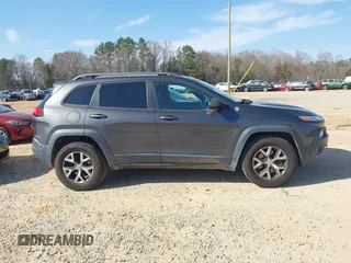 2014 Jeep Cherokee Trailhawk with VIN 1C4PJMBS6EW278987, listed as a IAAI auction lot 41789868 with 136,696 mi miles. Bid and sale history available at carsss.com. Image 14.