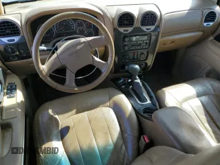 2003 GMC Envoy SLT z VIN 1GKDS13S032134647, wystawiony jako Copart lot #50137325 z przebiegiem 217 878 mil mil oraz Szkody całkowita. Historia ofert i sprzedaży dostępna na DreamBid. Obrazek 8.