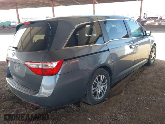 2012 Honda Odyssey EX-L with VIN 5FNRL5H6XCB103498, listed as a IAAI auction lot 42065658 with 104,933 mi miles and . Bid and sale history available at carsss.com. Image 4.