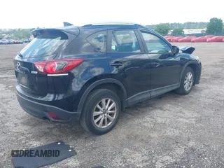 2016 Mazda CX-5 Sport with VIN JM3KE4BY2G0796577, listed as a IAAI auction lot 42230645 with 103,223 mi miles and . Bid and sale history available at DreamBid. Image 4.