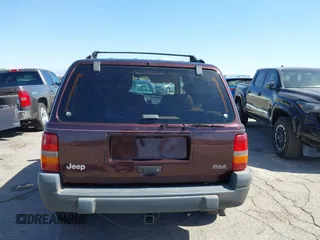 1996 Jeep Grand Cherokee Laredo with VIN 1J4GZ58S3TC391942, listed as a IAAI auction lot 41711778 with 202,765 mi miles. Bid and sale history available at carsss.com. Image 17.