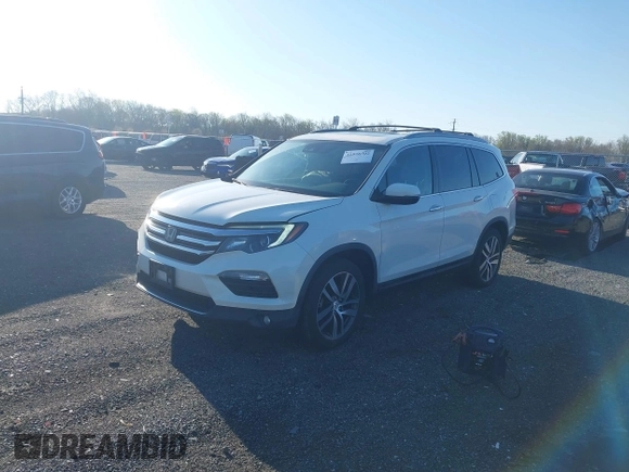 2017 Honda Pilot Elite with VIN 5FNYF6H00HB032386, listed as a IAAI auction lot 41976702 with 153,251 mi miles and . Bid and sale history available at DreamBid. Image 2.