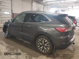 2020 Ford Escape Titanium with VIN 1FMCU9J95LUA39338, listed as a IAAI auction lot 42319122 with 34,631 mi miles and . Bid and sale history available at DreamBid. Image 3.