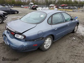 1999 Ford Taurus SE with VIN 1FAFP53U4XG150881, listed as a Copart auction lot 40964564 with 124,928 mi miles and Clean Title. Bid and sale history available at carsss.com. Image 3.