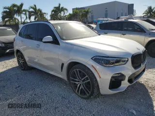 2019 BMW X5 xDrive40i with VIN 5UXCR6C50KLK86199, listed as a Copart auction lot 47523305 with 76,924 mi miles and Salvage Title. Bid and sale history available at DreamBid. Image 4.