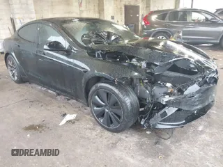 2022 Tesla Model S Plaid with VIN 5YJSA1E64NF477855, listed as a IAAI auction lot 41470591 with Not Provided miles and . Bid and sale history available at carsss.com. Image 1.