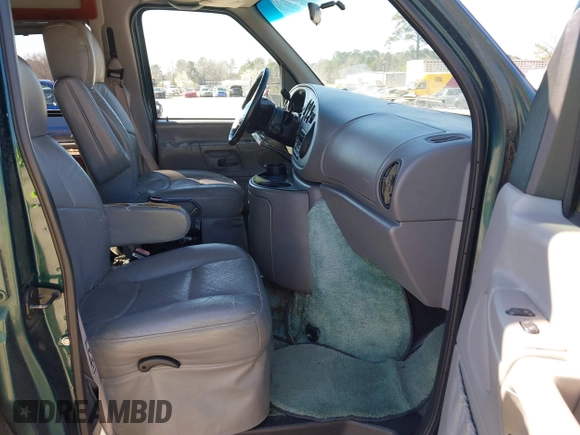 1999 Ford Econoline Cargo with VIN 1FDRE14W2XHB18989, listed as a IAAI auction lot 41740961 with 152,028 mi miles. Bid and sale history available at carsss.com. Image 5.