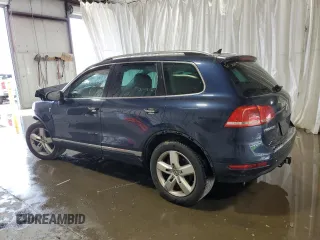 2014 Volkswagen Touareg Sport с VIN WVGEF9BP2ED002718, выставлен на аукционе Copart как лот 59526575 с пробегом 194 480 миль миль и На запчасти • Non repairable. История ставок и продаж доступна на DreamBid. Изображение 2.