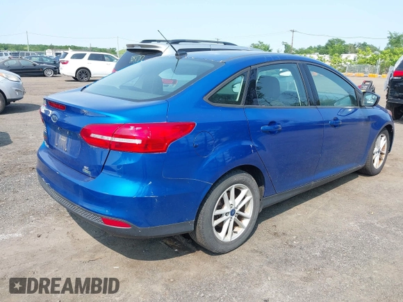2018 Ford Focus SE z VIN 1FADP3FE1JL254632, wystawiony jako IAAI lot #42408683 z przebiegiem 74 696 mil mil oraz . Historia ofert i sprzedaży dostępna na DreamBid. Obrazek 4.