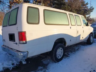 2010 Ford Econoline Wagon XL with VIN 1FBSS3BL9ADA55363, listed as a IAAI auction lot 41179750 with 127,918 mi miles. Bid and sale history available at carsss.com. Image 4.