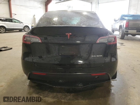 2021 Tesla Model Y Long Range with VIN 5YJYGDEE8MF252824, listed as a Copart auction lot 53801315 with 31,084 mi miles and Salvage Title. Bid and sale history available at DreamBid. Image 6.