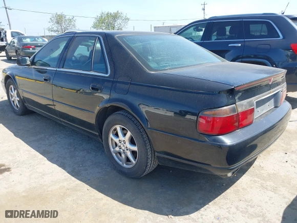 1998 Cadillac Seville Touring STS with VIN 1G6KY5499WU916185, listed as a IAAI auction lot 42035783 with 164,763 mi miles. Bid and sale history available at carsss.com. Image 3.
