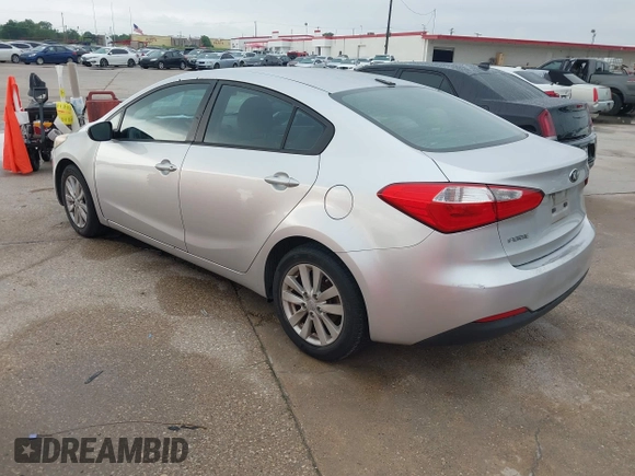 2014 Kia Forte LX with VIN KNAFX4A63E5099825, listed as a IAAI auction lot 42119316 with 174,551 mi miles and . Bid and sale history available at carsss.com. Image 3.