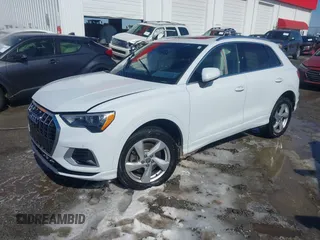 2020 Audi Q3 Premium with VIN WA1AECF31L1098425, listed as a IAAI auction lot 41640806 with 100,462 mi miles and . Bid and sale history available at DreamBid. Image 2.